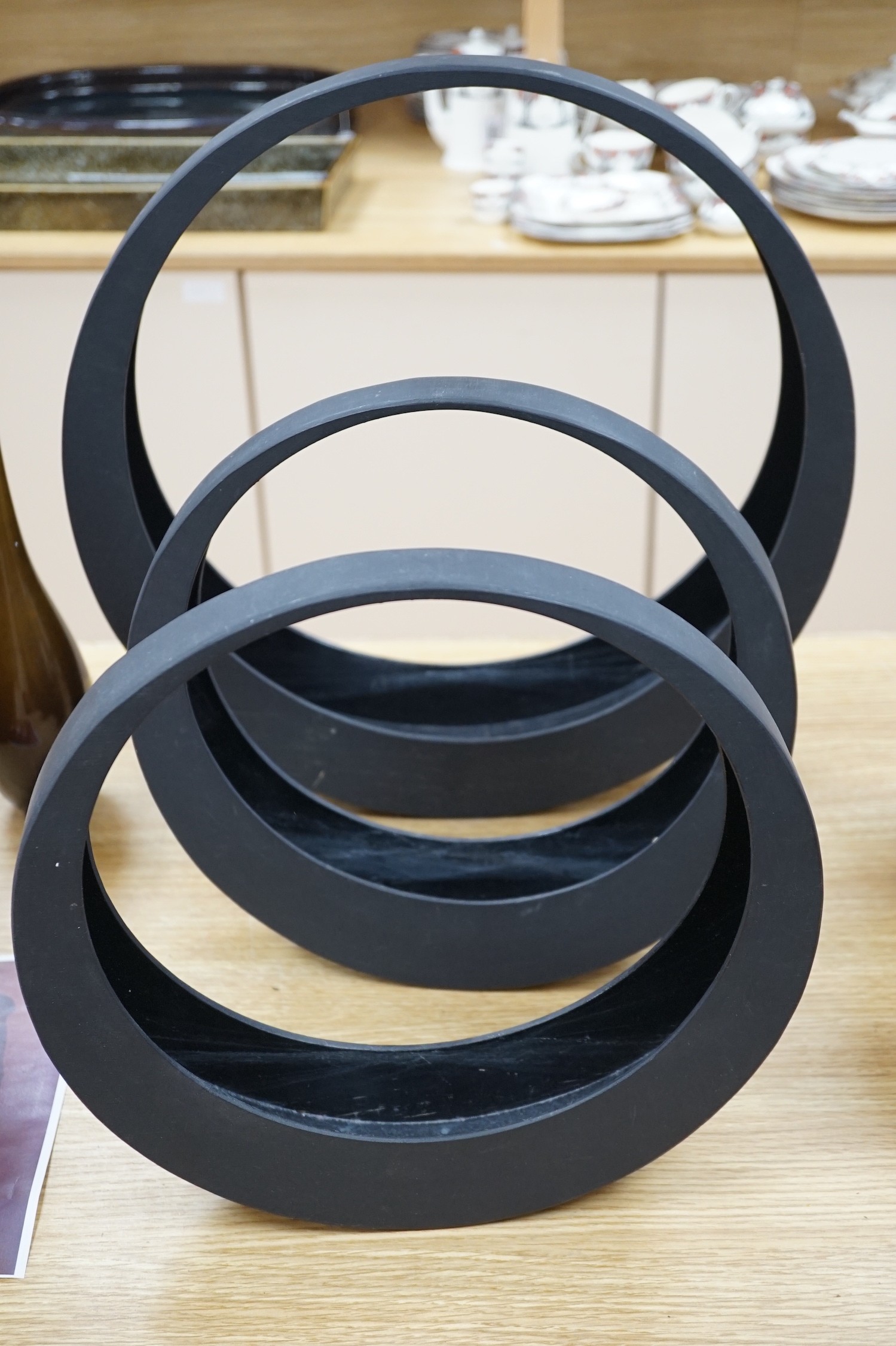 A Japanese bronze bottle vase, 30cm high, three circular black painted wooden abstract sculptures, possibly by Huw Powell Roberts, tallest 42.5cms
